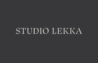 Off-white serif wordmark reading STUDIO LEKKA centered on a solid dark charcoal grey background.