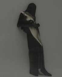 Model silhouetted in a dark hooded garment wearing a shimmering metallic satin maxi dress against a muted grey background.