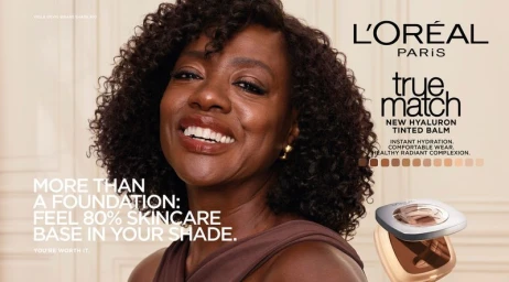 Viola Davis smiling in a brown top for the L'Oreal Paris True Match Hyaluron Tinted Balm campaign.