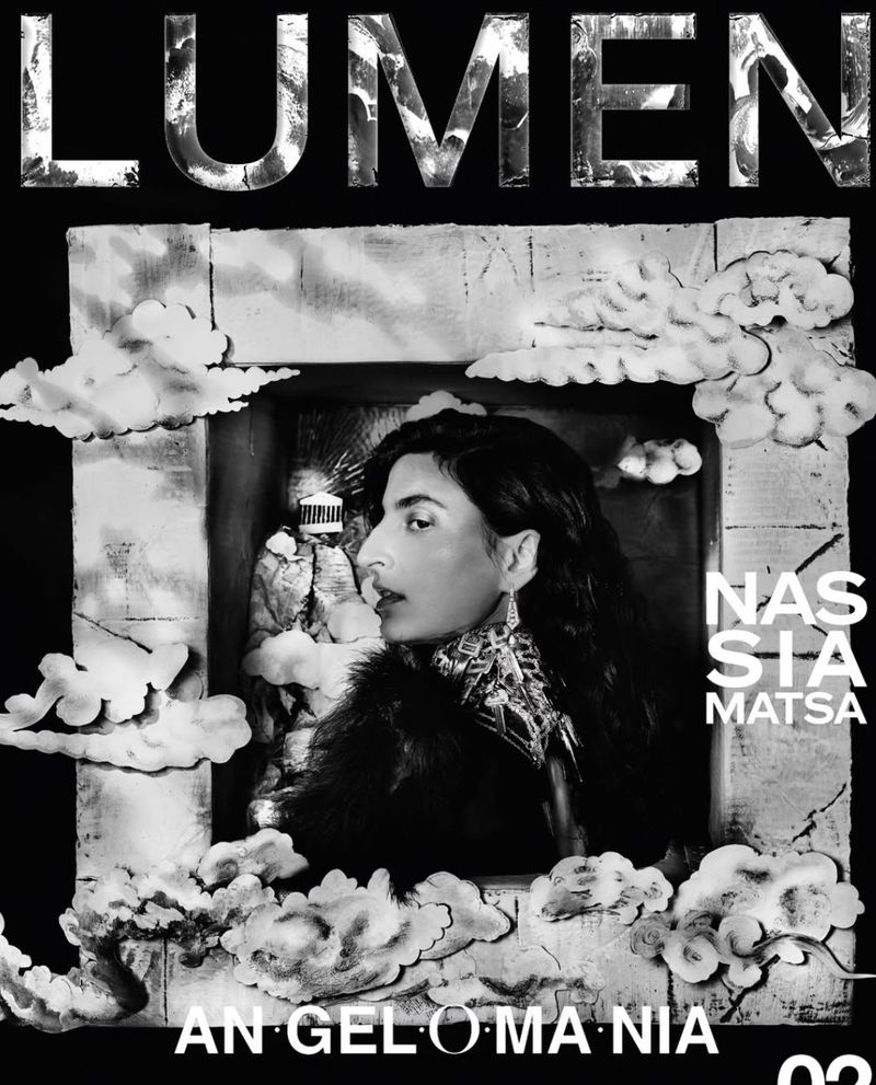 Model Nassia Matsa framed by sculptural clouds on a black and white cover for Lumen Magazine.