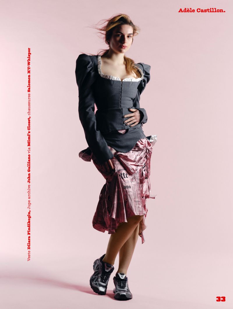 Adele Castillon in a dark puffy-shouldered top and pink skirt against a pink background for Magazine Antidote