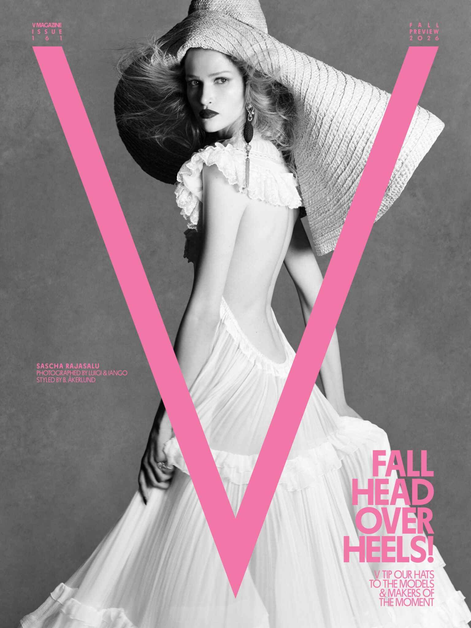 Model Sascha Rajasalu poses in an oversized woven hat and a backless ruffled white gown on a V Magazine cover.