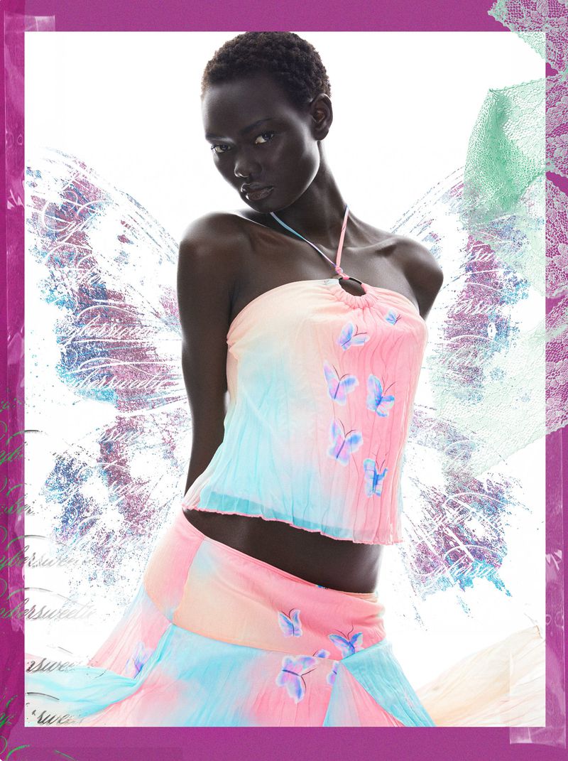 Model Ateta Jok wearing a pastel pink and blue butterfly print halter top and matching skirt against fairy wing graphics.