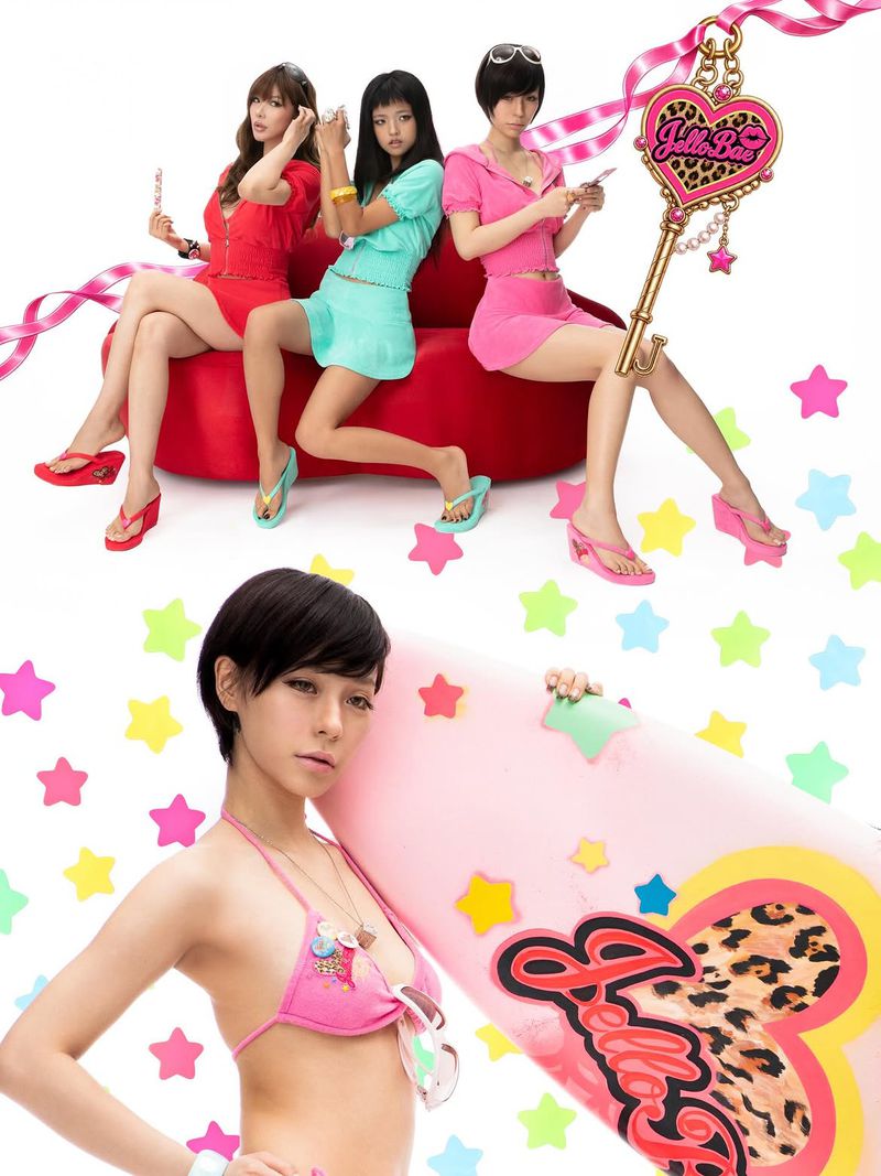 Three young women in colorful Y2K outfits seated on a red couch above a woman in a pink bikini holding a pink surfboard.