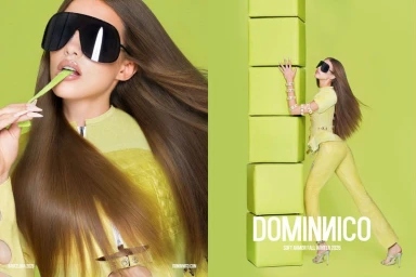 Model wearing oversized black shield sunglasses and a textured lime-yellow matching outfit in a monochrome green studio setting.