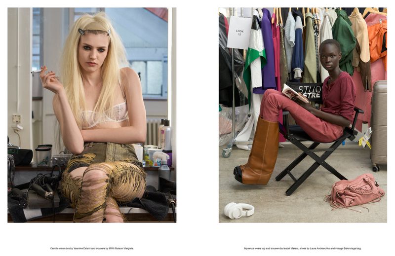 Two fashion models backstage at a fashion show, one blonde smoking a cigarette and one Black woman reading a book in brown boots.