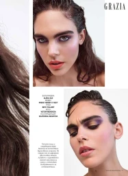 Magazine editorial page featuring two close-up beauty portraits of a model with purple eye makeup and wet-look hair on a white backdrop.