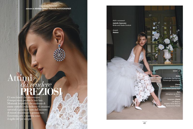 Magazine editorial spread featuring a model in a white lace bridal gown with a tulle train and large diamond drop earrings.