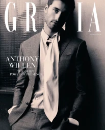 Anthony Willen wearing a dark tailored suit and draped silk tie scarf on the Grazia Bulgaria June 2026 magazine cover.