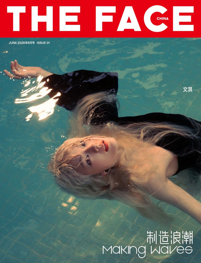 Young woman with blonde hair in a black dress floating on her back in a turquoise swimming pool for The Face China cover.