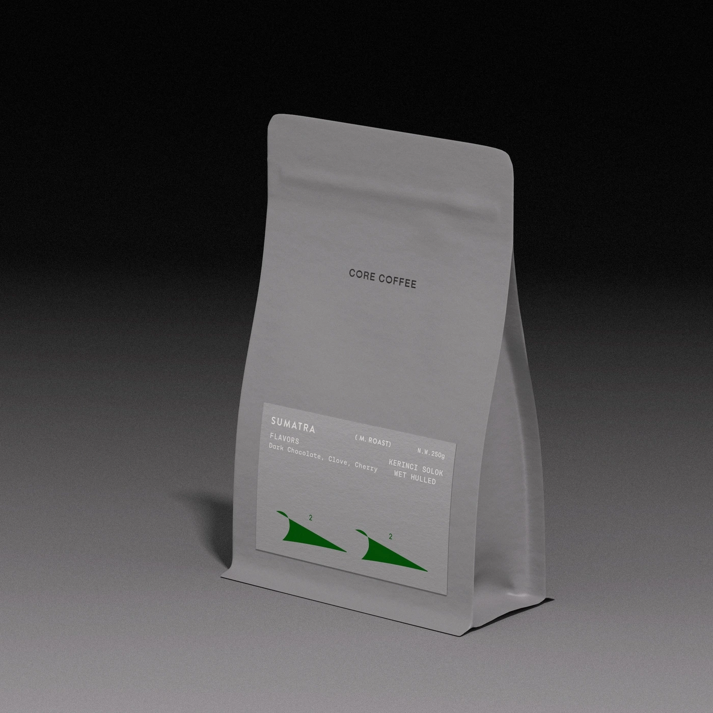 Matte grey stand-up coffee bean pouch for Core Coffee with clean typography set against a dark gradient studio background.