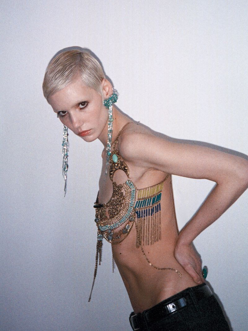 Model Paulina Bricca wearing elaborate beaded body jewellery and long drop earrings in an editorial for Elle Kazakhstan.