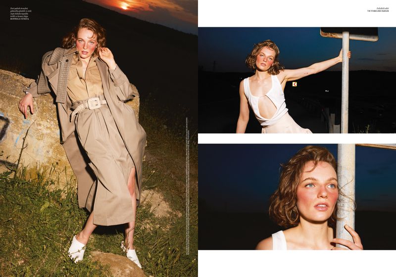 Model Fran Summers posing in a beige trench coat and a white cutout top in an outdoor editorial spread.
