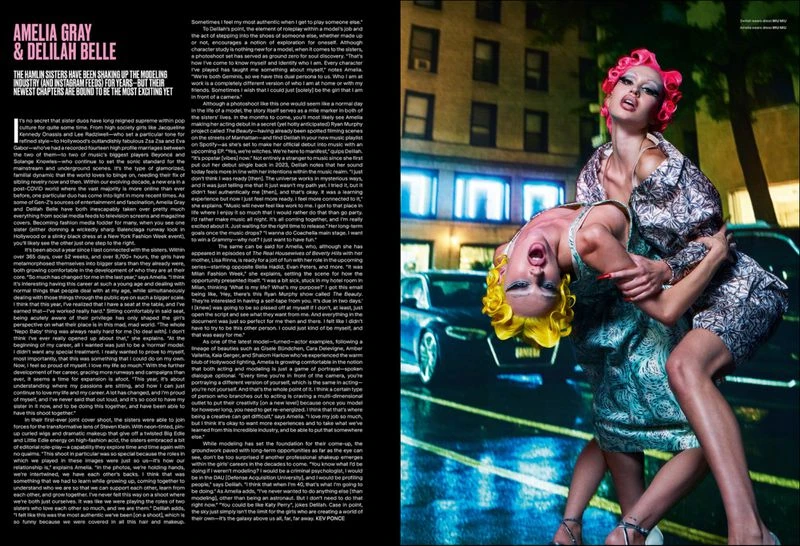 Two fashion models, Amelia Gray and Delilah Belle, strike a dynamic pose outdoors at night wearing patterned dresses with a car in the background.