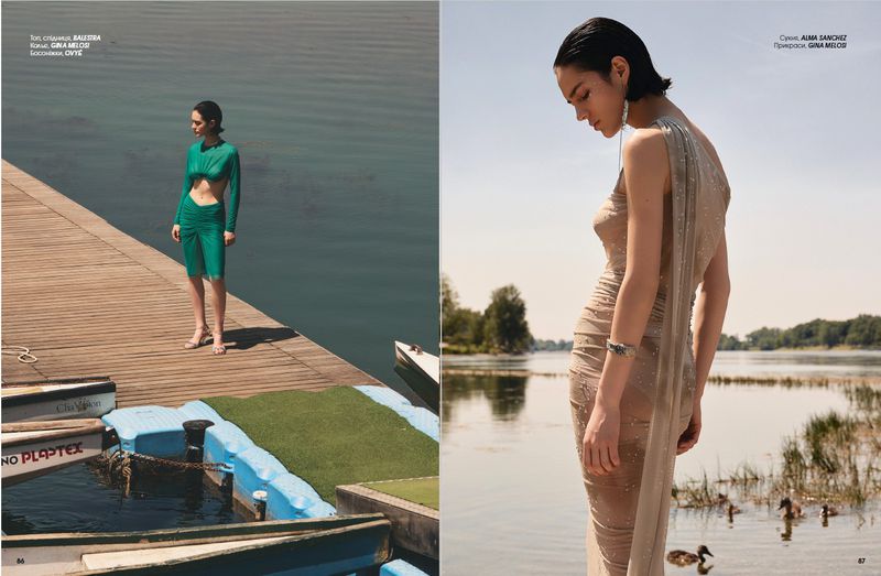 Editorial spread of model Rita Santos wearing a green ruched outfit on a wooden dock and a draped beige gown beside a lake.