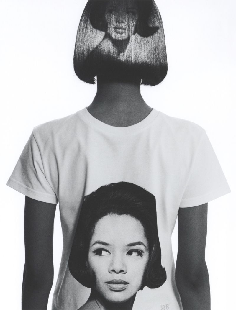 Monochrome portrait of a model in a white t-shirt featuring a retro woman print with a matching face projected onto the bob hairstyle.