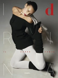Irina Shayk in a black off-shoulder top and white tights kneeling in a dynamic pose for D Repubblica magazine cover.