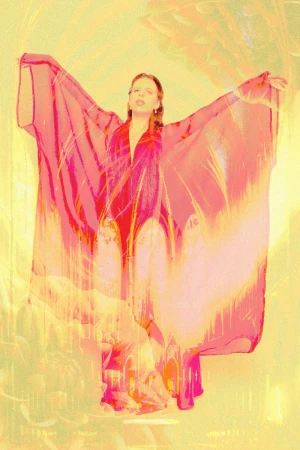 Woman in sheer red cape with arms outstretched in a stylized portrait with warm golden tones for Kaltblut Magazine
