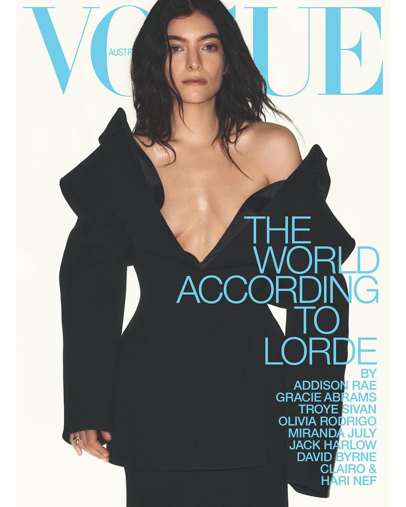 Lorde poses in a black dress on a Vogue Australia cover. She has shoulder-length dark hair, and the magazine's title is in light blue.