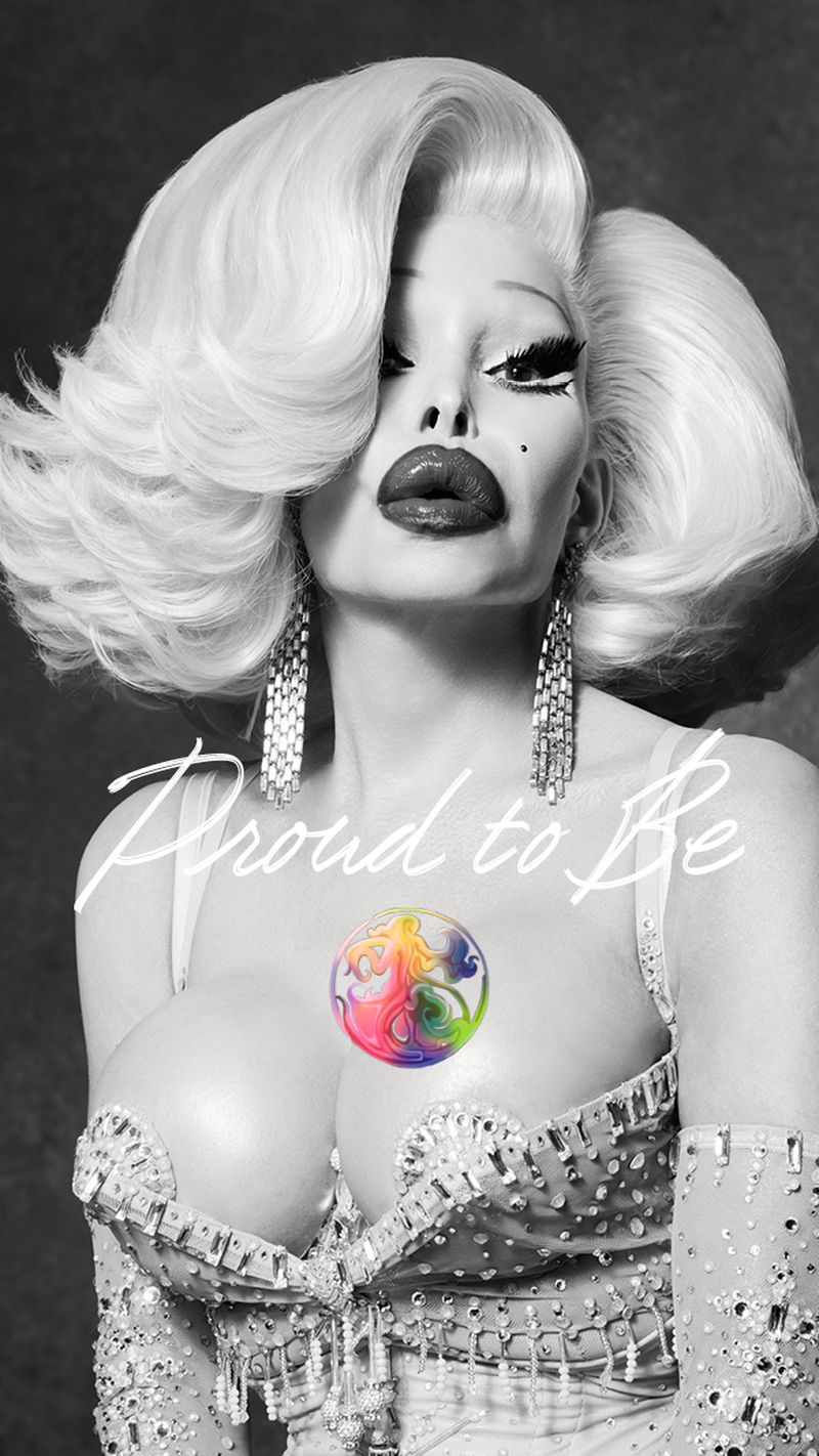 Monochrome portrait of Amanda Lepore with voluminous retro hairstyle and crystal embellished corset with Proud to Be text overlay.