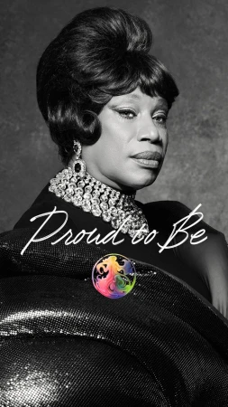 Black and white portrait of a person with a retro bouffant hairstyle wearing an ornate crystal choker and black sequin wrap.