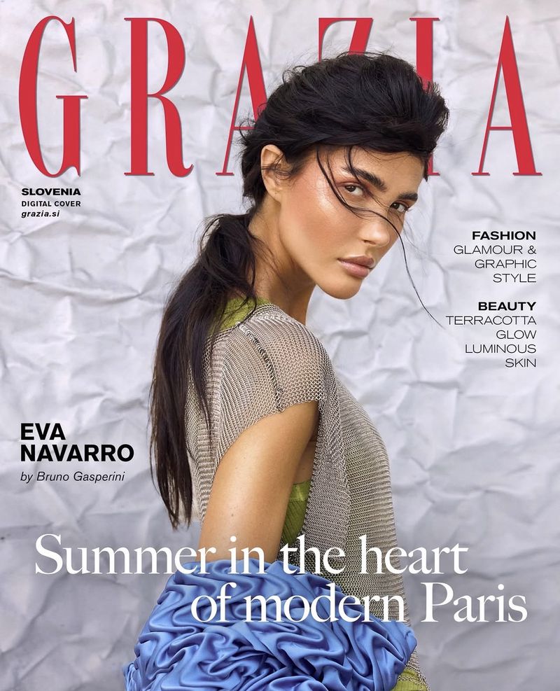 Model Eva Navarro on the Grazia Slovenia digital cover against a crinkled white backdrop wearing a metallic mesh top and blue ruffle.