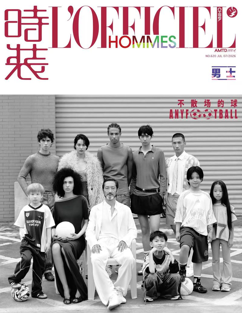 Black and white magazine cover featuring a group of ten diverse models posing outdoors with football themes for L'Officiel Hommes China.