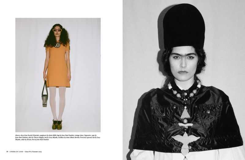 Editorial fashion shot featuring two women in distinct outfits against a stark white backdrop, showcasing contrasting vintage-inspired aesthetics.