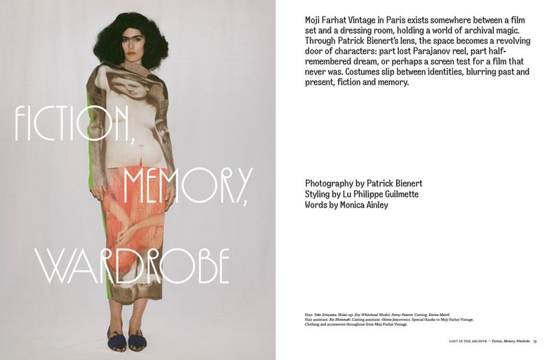 Adult woman stands in studio wearing printed top and skirt, posing for editorial fashion shot with text overlay.