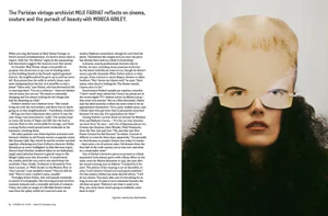 Magazine editorial spread showing interview text on the left and a portrait of a woman wearing a paper cutout mask on the right.