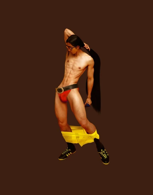Man in red briefs, yellow underpants down around his ankles, and glasses poses with long hair on brown background.