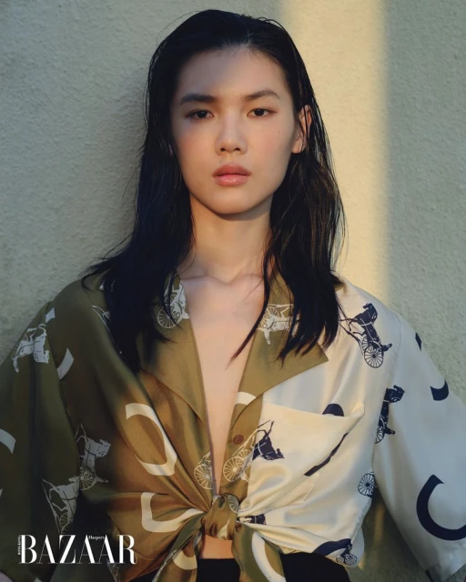 Model Du Si Ying wearing a patterned silk shirt with horse motifs for Harper's Bazaar Hong Kong.