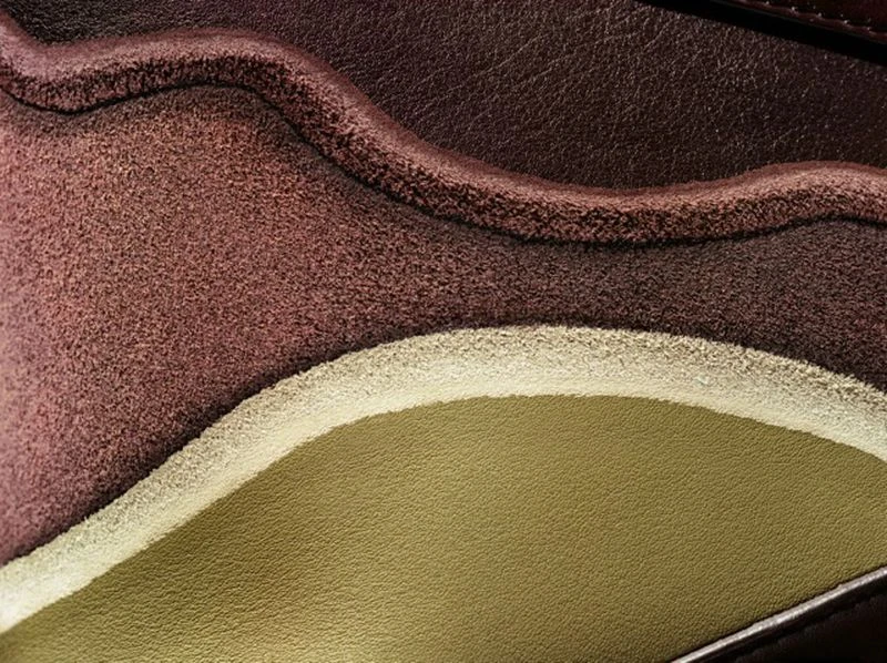 Close-up of a multi-textured surface featuring shades of brown and beige, showcasing a tactile and visually rich composition.
