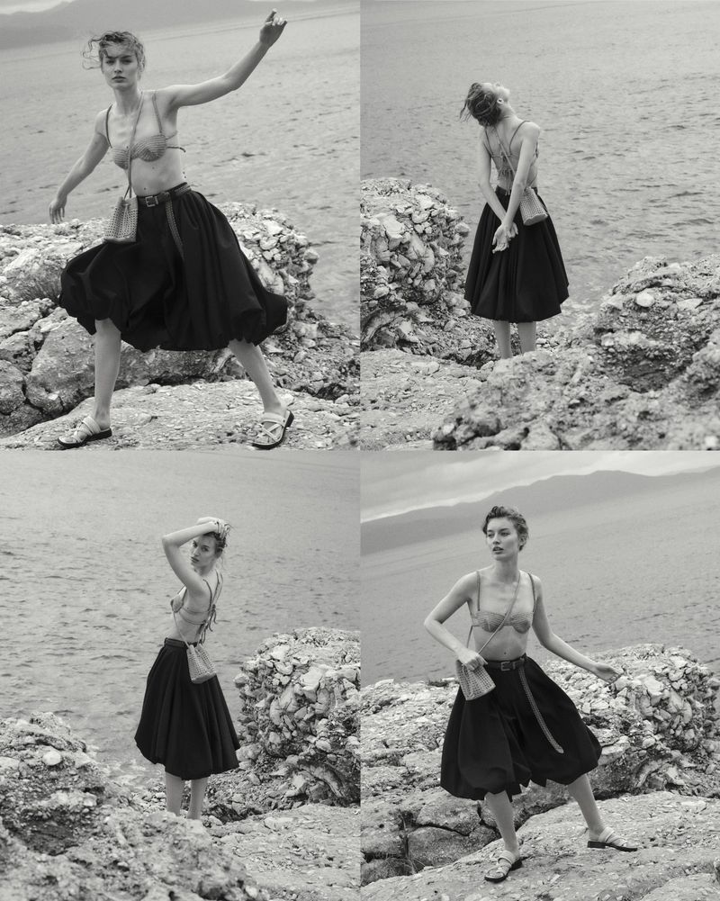 Four-panel black and white fashion editorial of a woman posing on a rocky coastline in a voluminous midi skirt and bralette.