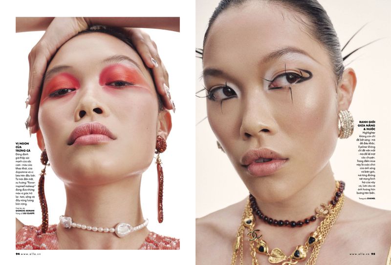 Editorial fashion shot of two Asian female faces wearing bold makeup, jewelry, and elaborate hairstyles against a bright background.