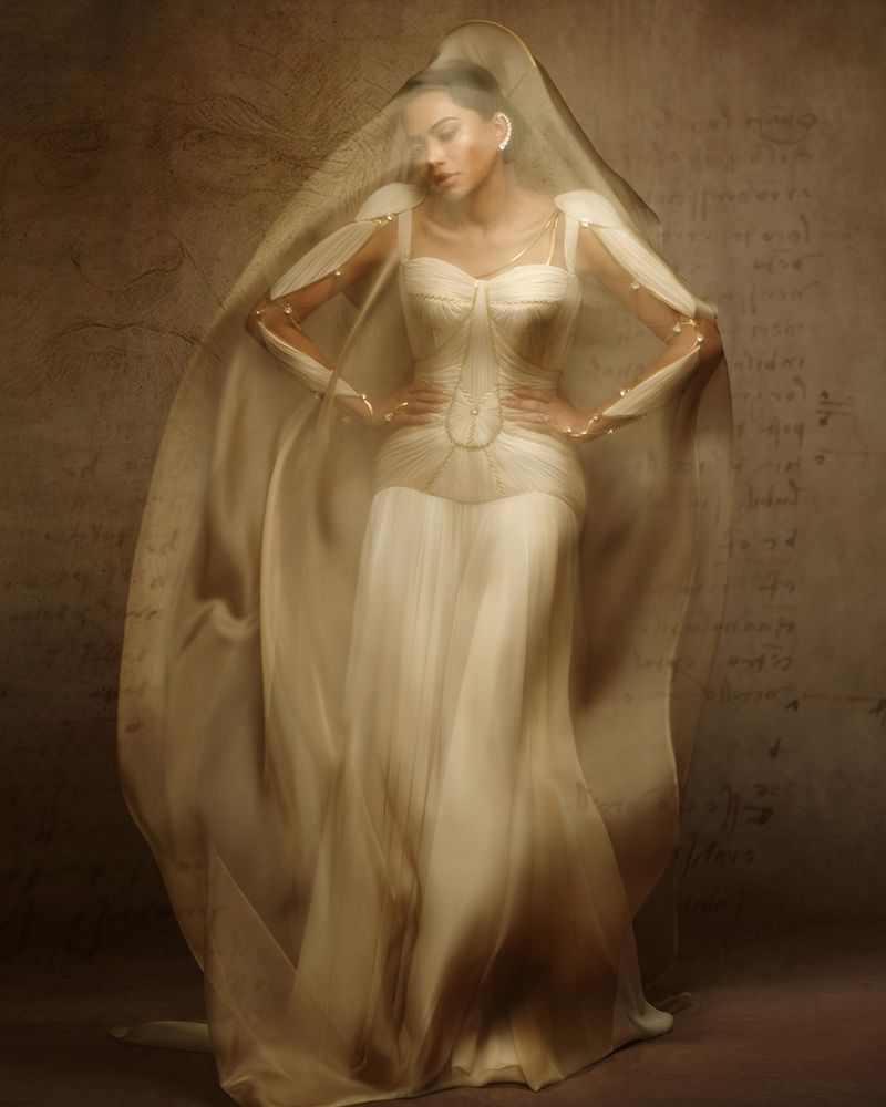 Woman in white sculptural gown under a sheer veil against a textured brown background for Elle Slovenia by Alikhan