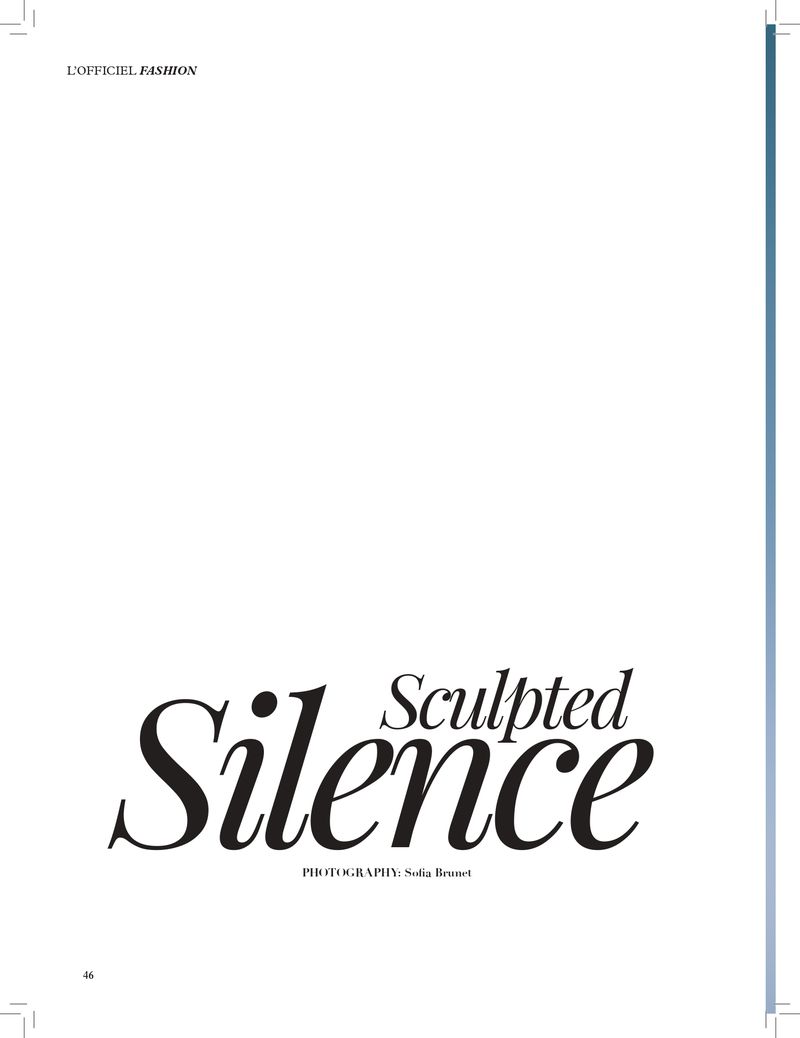 Studio shot of magazine cover featuring stylized text 'Sculpted Silence', set against a clean white backdrop with subtle blue side accents.