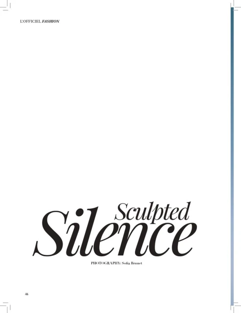 Studio shot of magazine cover featuring stylized text 'Sculpted Silence', set against a clean white backdrop with subtle blue side accents.