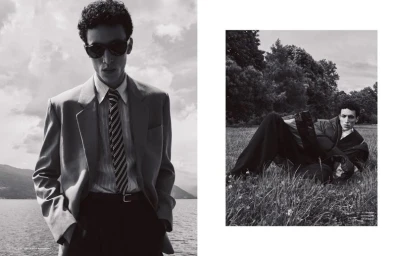 Black and white editorial diptych of a male model in a suit jacket and tie by a lake, and reclining in a grassy field