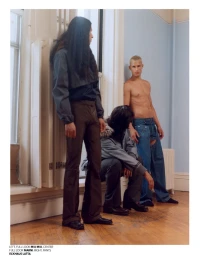 Three male models posing indoors by a window and pale blue wall, styled in Miu Miu, Marni, and Eckhaus Latta fashion.