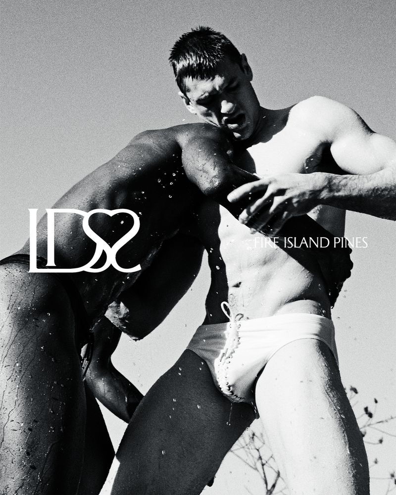 Black and white image of two athletic adult males wrestling in swimwear in an outdoor environment; DSS branding and text overlays.