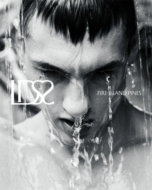 Monochrome close-up of a man's face with water cascading down, against a blurred background with text overlay, creating a dramatic effect.