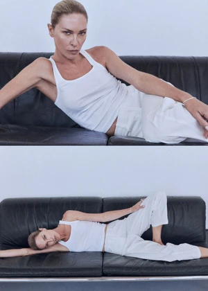 Diptych of model Erin Wasson reclining on a black leather couch wearing a white tank top and white trousers.