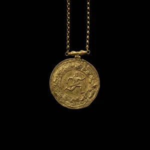 Engraved gold circular medallion pendant featuring an archer relief hanging on a link chain against a solid black background.