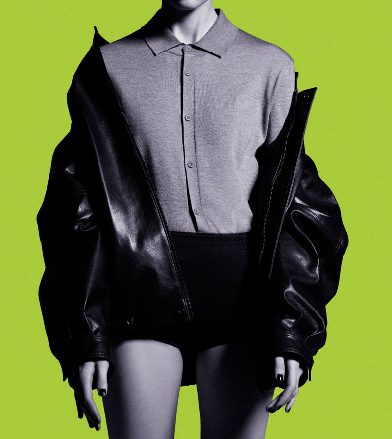 Cropped studio portrait of an adult female in a grey sweater, black jacket, and bottoms against a vibrant lime green background.