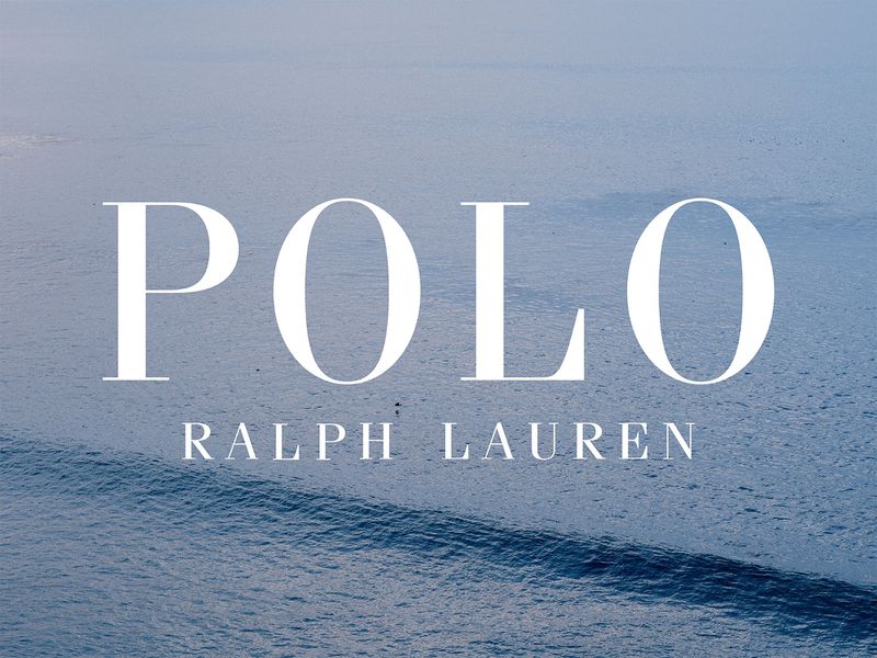 White Polo Ralph Lauren logo text centered over an expansive blue ocean surface with gentle rolling waves.