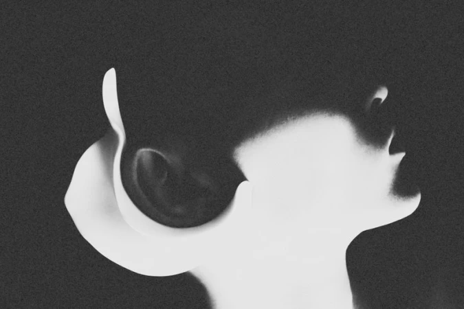 High-contrast black and white profile silhouette of model Arnau Sarda with graphic lighting and fine film grain.