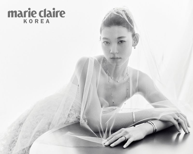 Model Sol Jeong wearing a sheer bridal veil and fine jewelry for Marie Claire Korea.