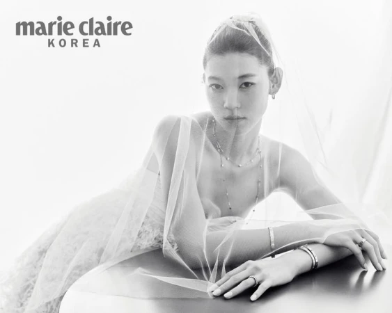Model Sol Jeong wearing a sheer bridal veil and fine jewelry for Marie Claire Korea.