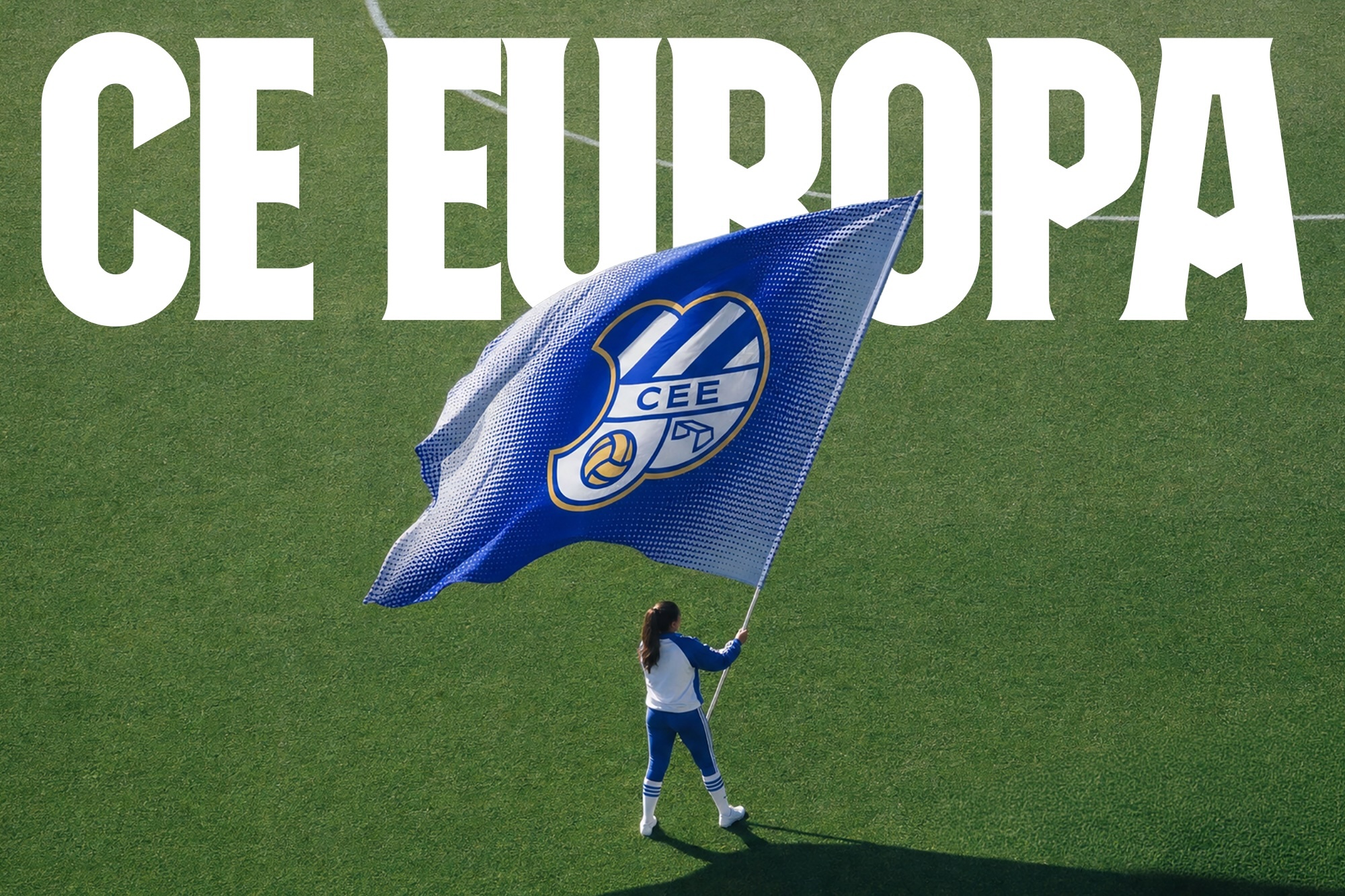 A person holding a large blue CE Europa flag on a green grass soccer field below bold white CE Europa typography.